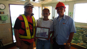 Capt Cesar M. Grumo (middle), vessel master of MV West Ocean 3, receiving a certificate for the vessel’s maiden voyage to Subic Bay’s New Container Terminal 1 (NCT1) from Jay Silva, Subic Bay International Terminal Corp (SBITC) safety officer (left), and Donato Teodoro (rightmost), SBITC operations superintendent. SBITC operates NCT1. Photo courtesy of SBITC.