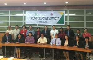 At the launch of the Subic Bay Metropolitan Authority (SBMA) electronic Billing and Payment System were InterCommerce Network Services, Inc president Francis Lopez (seated, leftmost), SBMA chairman and administrator Roberto Garcia (seated, fourth from left) and SBMA senior deputy administrator for Seaport and Airport Marcelino Sanqui (seated, fifth from left).