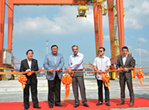 International Container Terminal Services, Inc (ICTSI) and government officials during ribbon-cutting ceremonies marking the start of Yard 7 operations at the Manila International Container Terminal (MICT), from left: Atty Juan Sta. Ana, Philippine Ports Authority general manager; Jose Rene D. Almendras, Cabinet Secretary; Enrique K. Razon Jr., ICTSI chairman and president; Francisco Domagoso, Manila Vice Mayor; and Christian R. Gonzalez, ICTSI senior vice president and head of Asia Pacific Region and MICT. Behind them are two of the four recently commissioned rubber-tired gantry cranes.